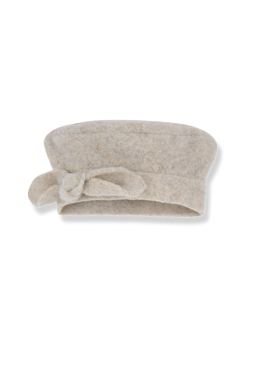 Beige towel with a knot on a white background