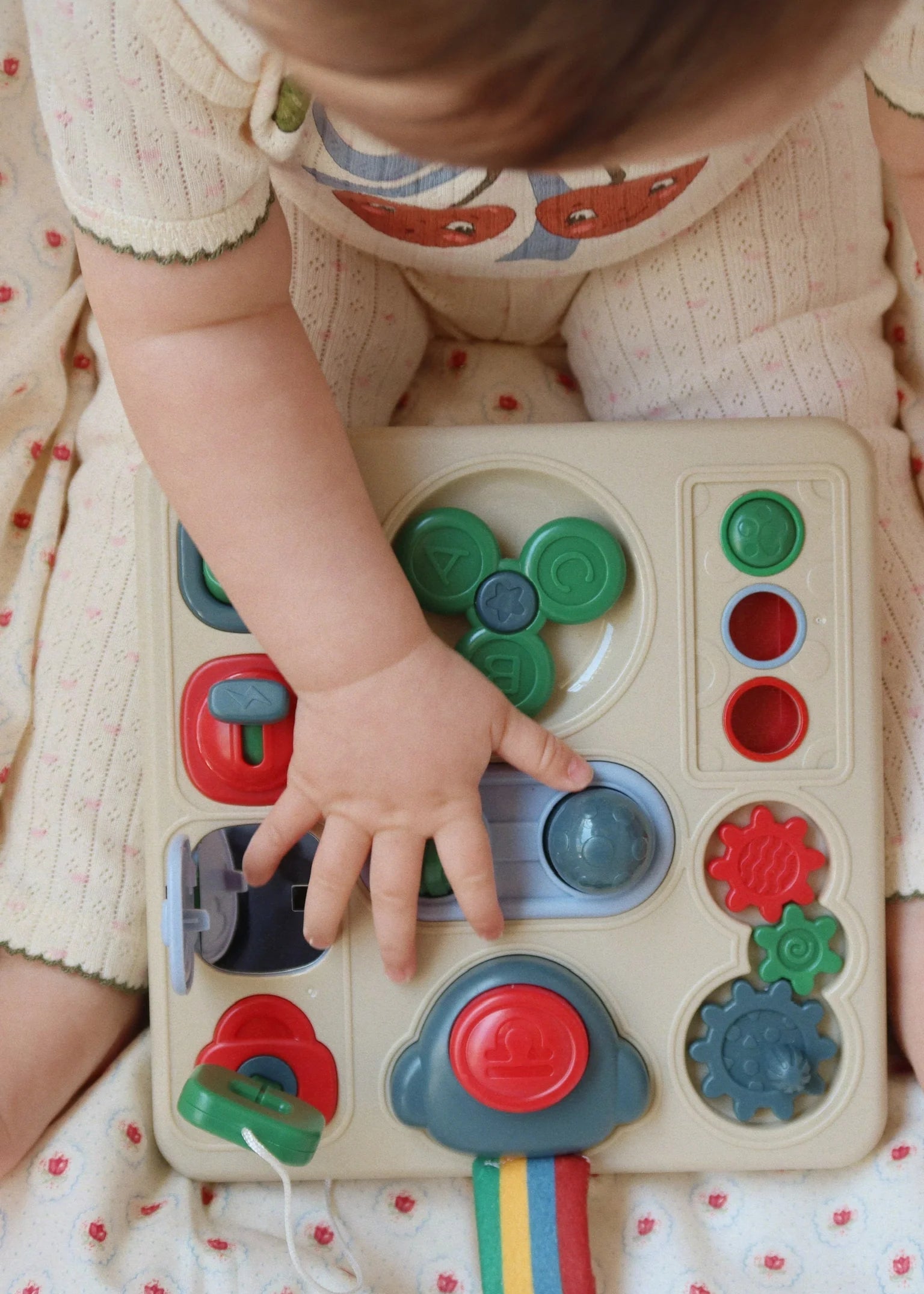Child playing with a colorful educational toy