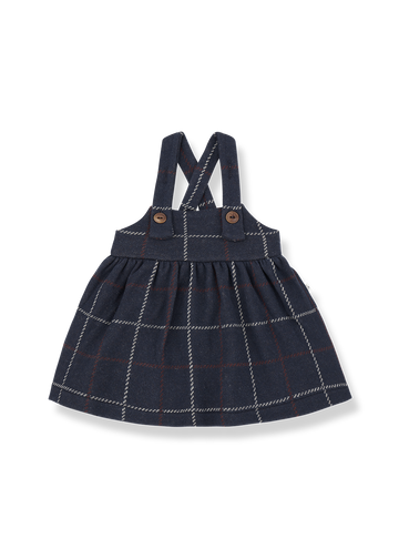 Navy checkered dress with suspenders on a white background