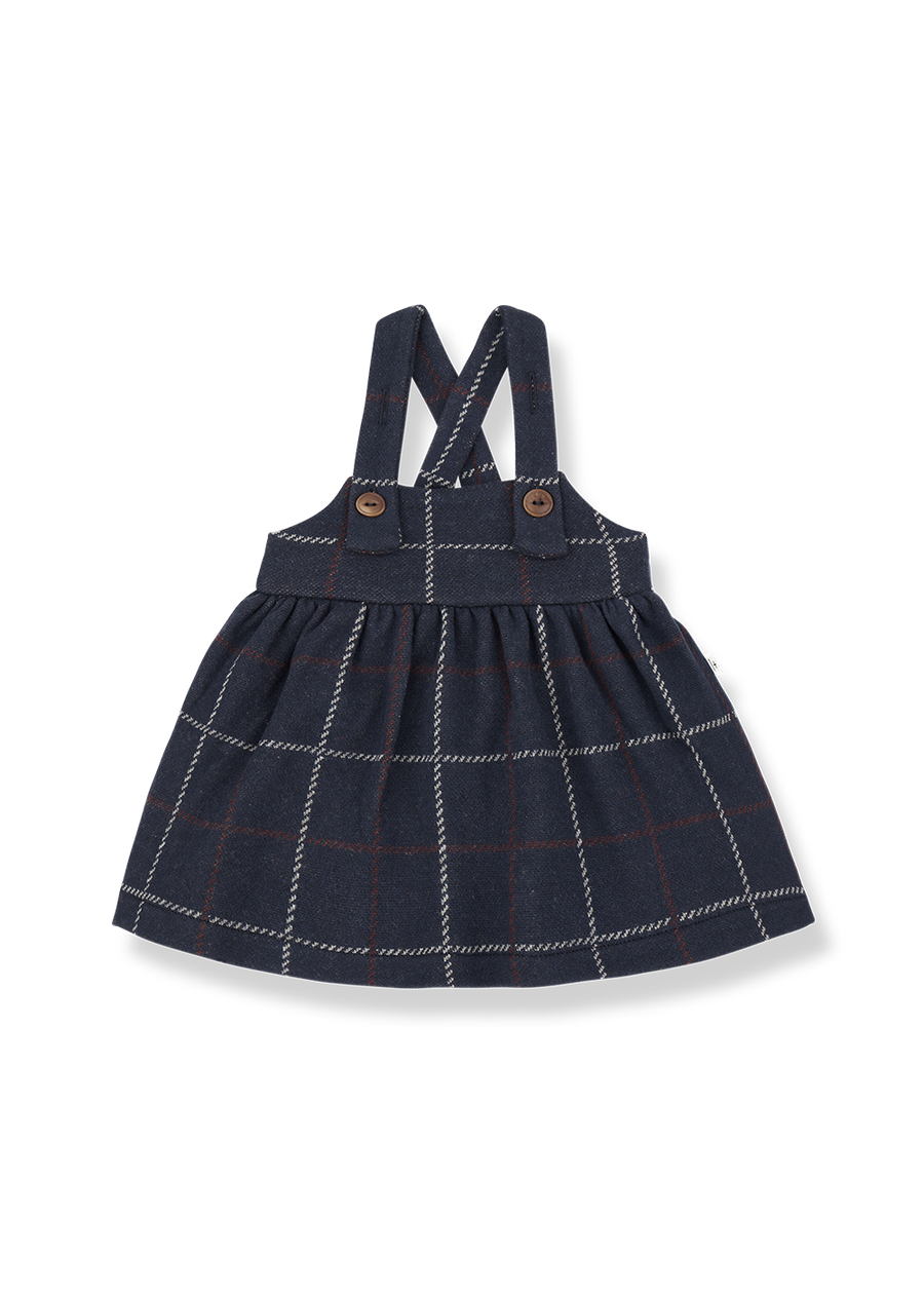 Navy checkered dress with suspenders on a white background