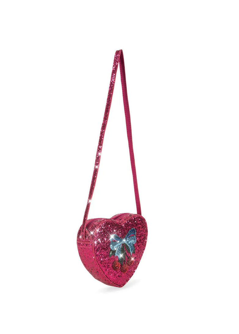 Heart-shaped pink glitter bag with a blue butterfly design on a white background