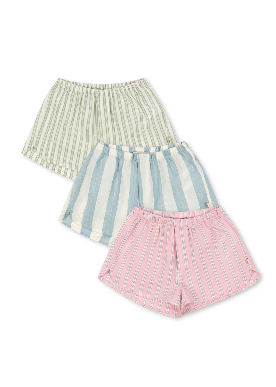Three pairs of striped shorts in green, blue, and pink on a white background