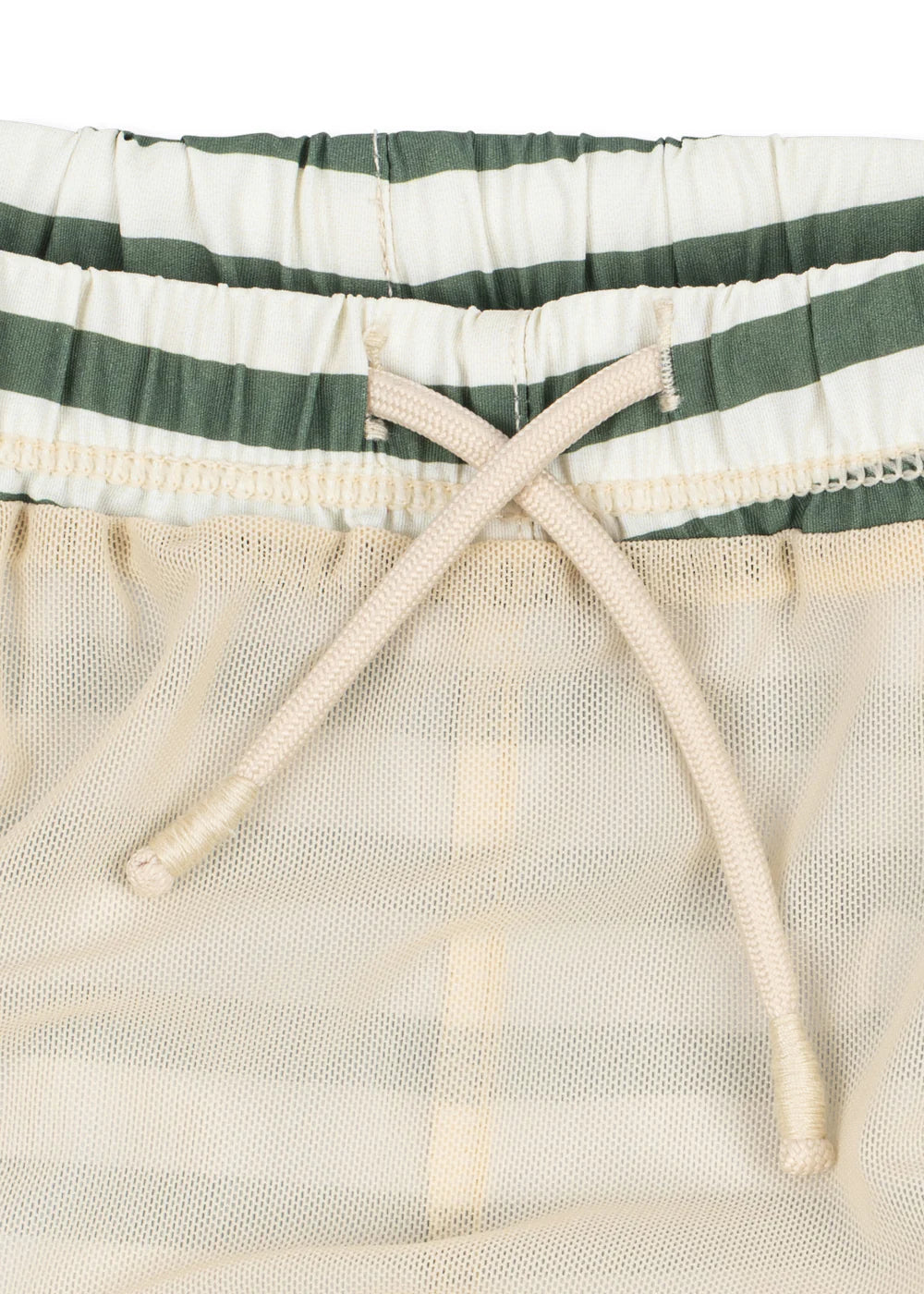 Close-up of a drawstring on a green and white striped fabric