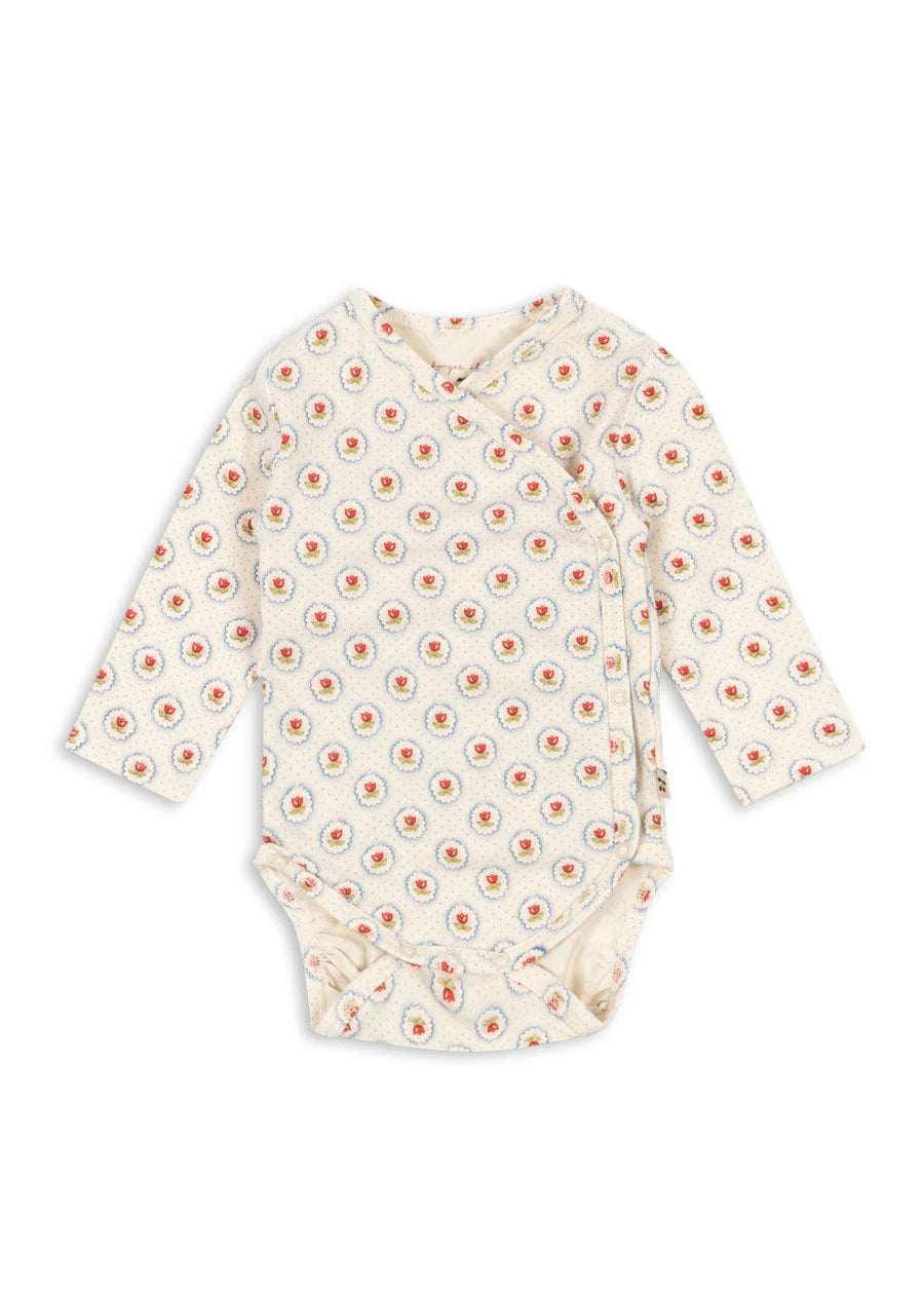 Baby onesie with floral pattern on a white background