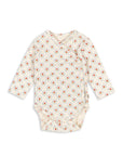 Baby onesie with floral pattern on a white background