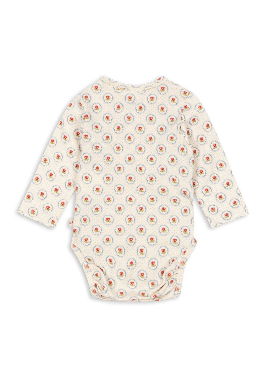 Baby bodysuit with floral pattern on a white background