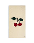 Beige towel with red cherries and green leaves on a white background