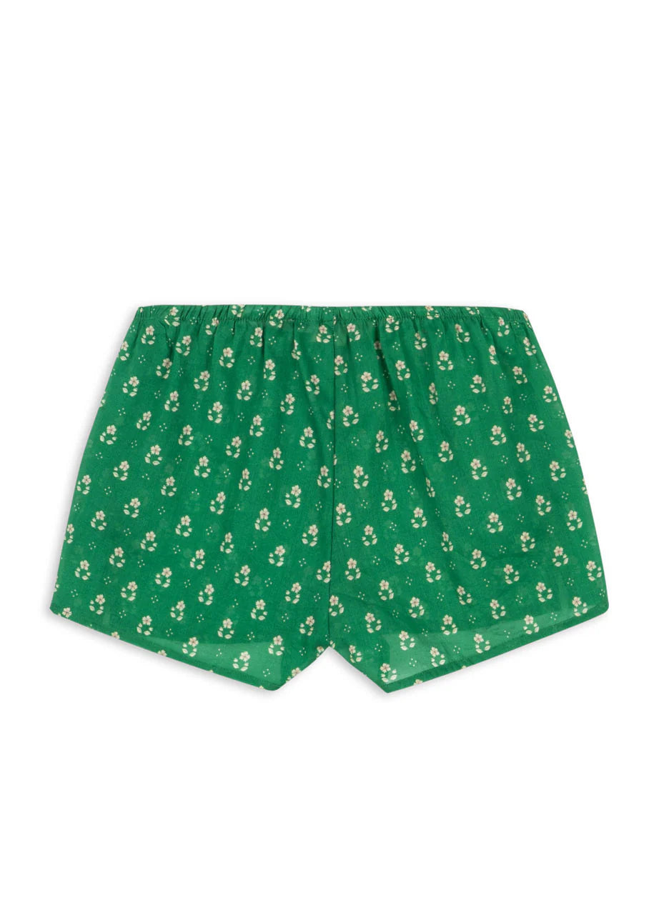 Green shorts with a small pattern on a white background