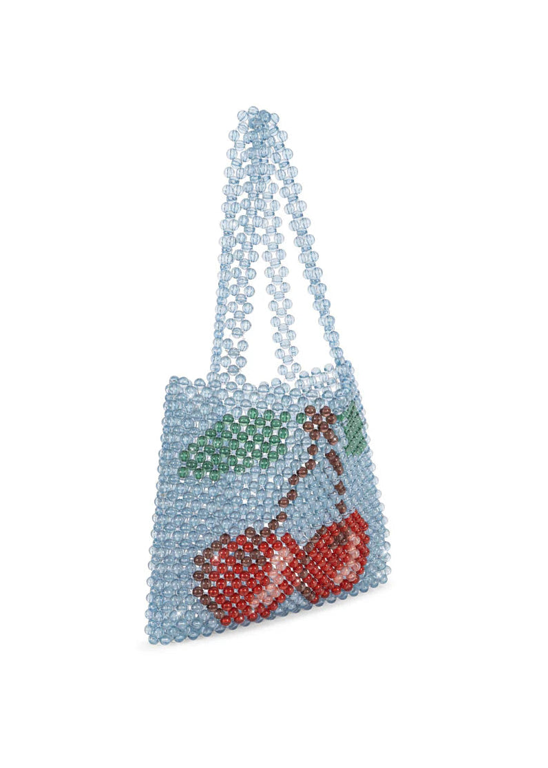 Beaded handbag with cherry design on a white background
