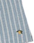 Blue and white striped fabric with a embroidered lemon design on a white background