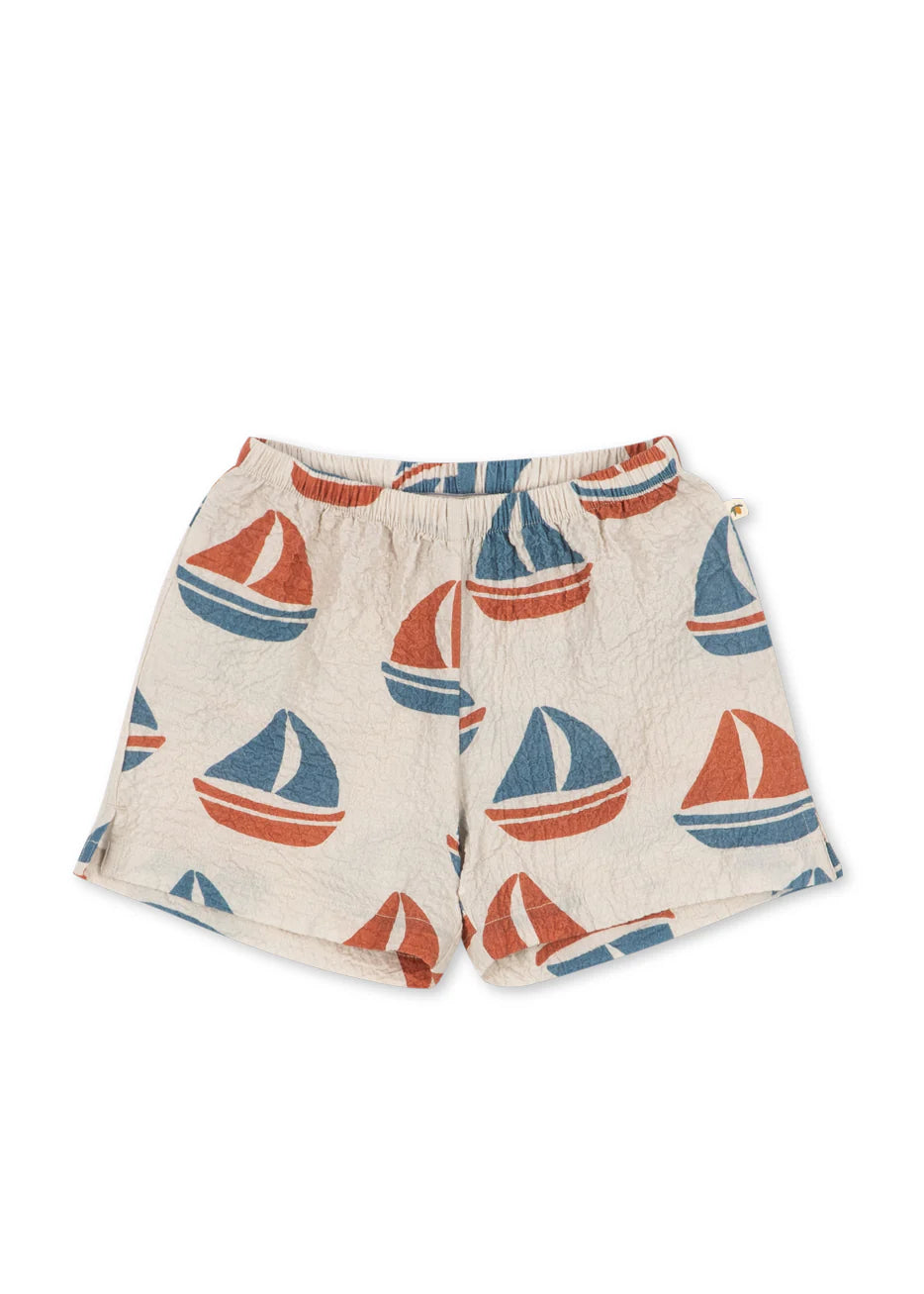 Shorts with sailboat pattern on a white background