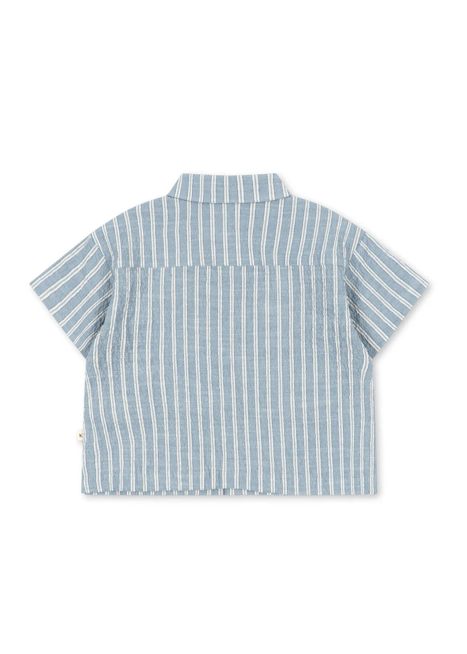Blue and white striped shirt on a white background