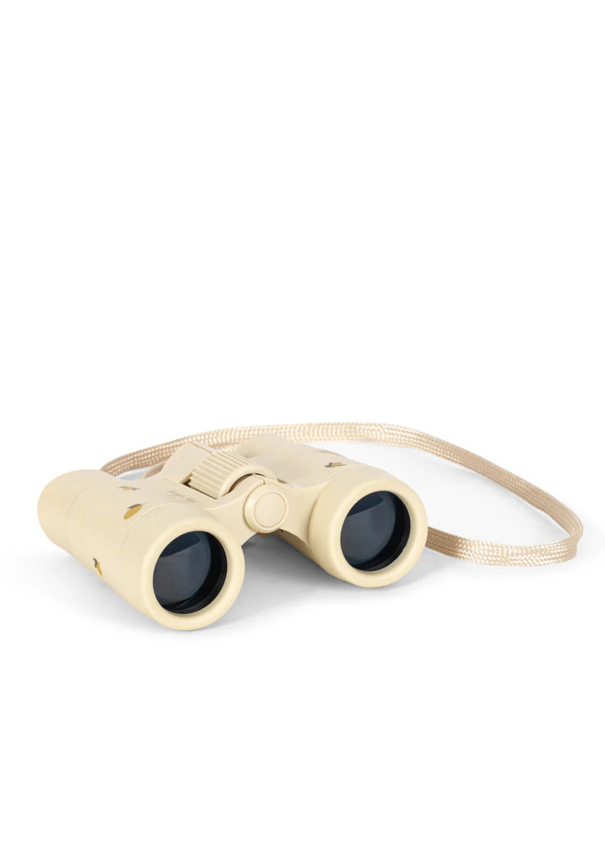 Beige binoculars on a white background