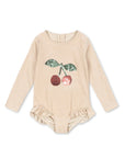 Beige baby bodysuit with cherry design on a white background
