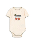 Beige baby onesie with cherry design on a white background