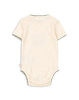 Beige baby bodysuit on a white background