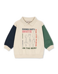 Children's sweater with a dinner party graphic on a white background