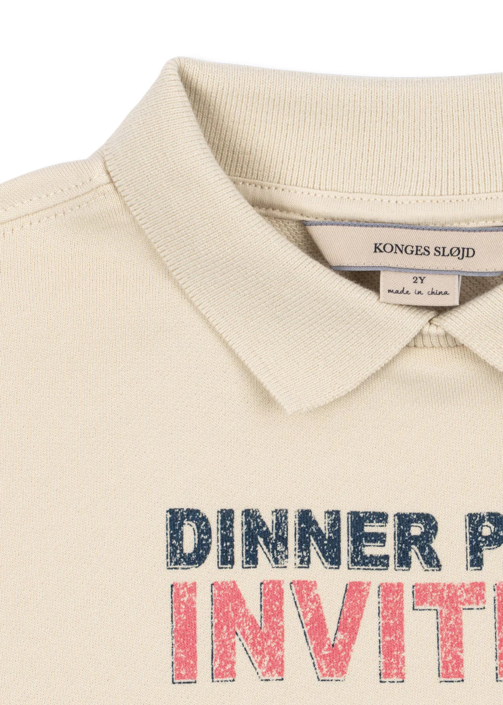 Beige polo shirt with 'Dinner Party Invite' text on a white background