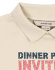 Beige polo shirt with 'Dinner Party Invite' text on a white background
