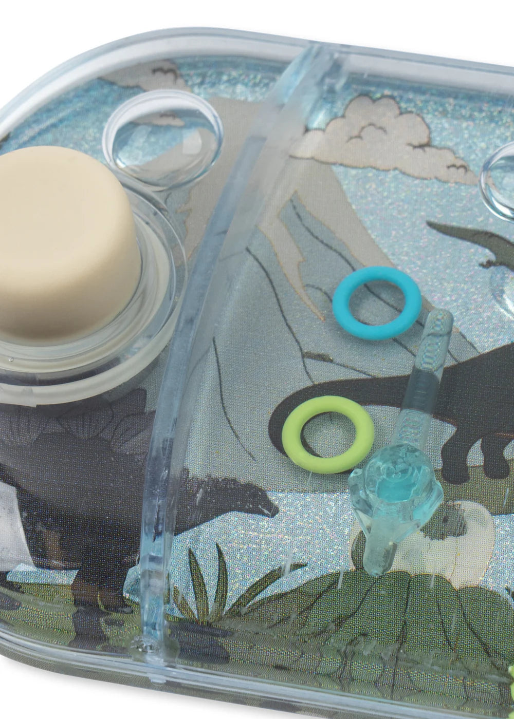 Clear plastic tray with animal illustrations and colorful rings on a white background