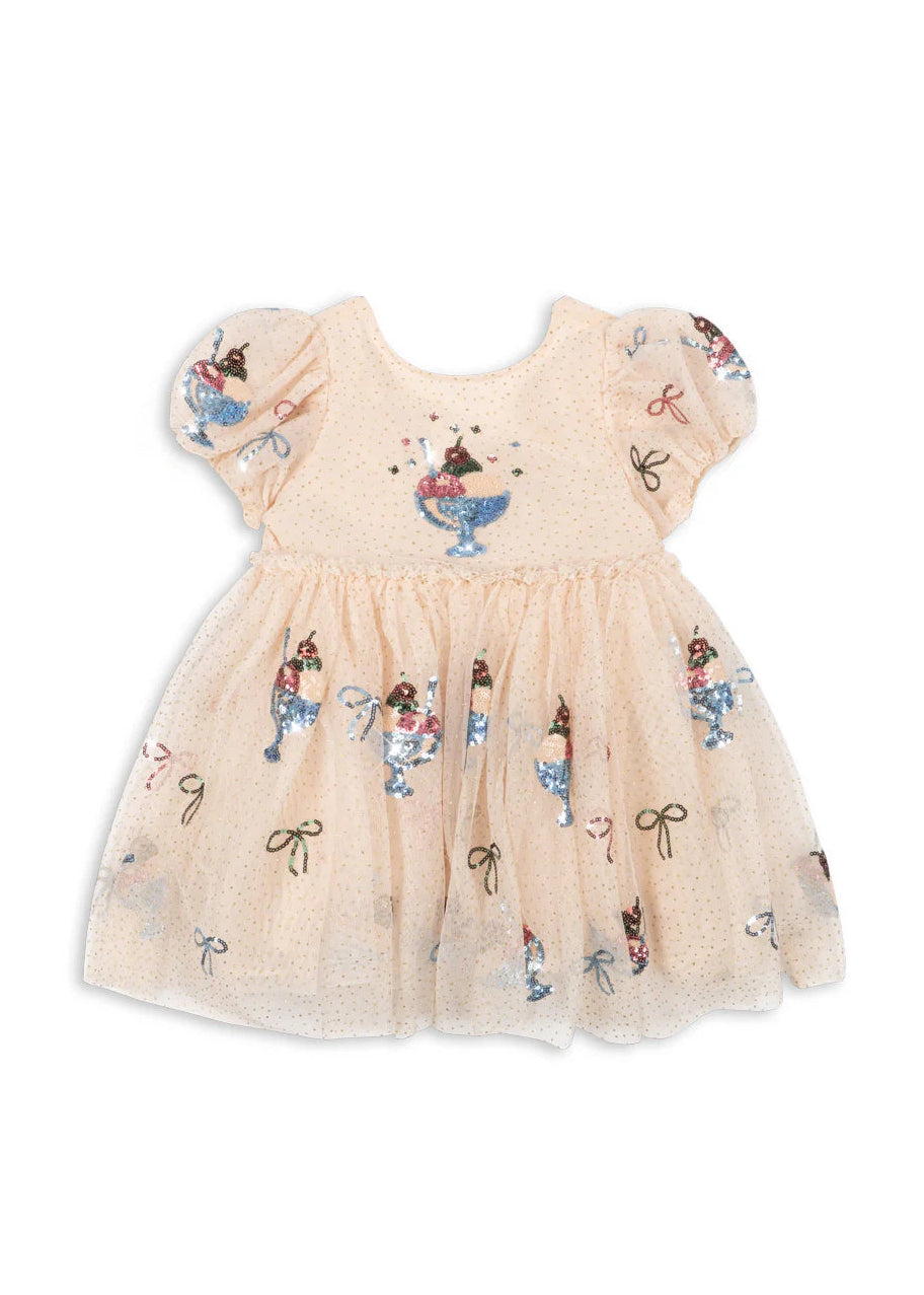 Beige dress with floral and bow patterns on a white background