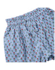 Light blue shorts with an all-over red and white floral print, featuring an elastic waistband and drawstring.