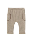 Beige baby pants on a white background