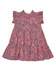 A girls' ruffled dress with a red and navy blue paisley pattern, shown flat against a white background.