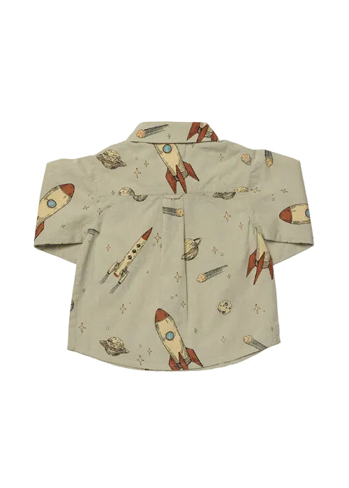 A short-sleeve button-up shirt in a light beige linen-like fabric, featuring a playful retro space print with rockets, planets, and stars.