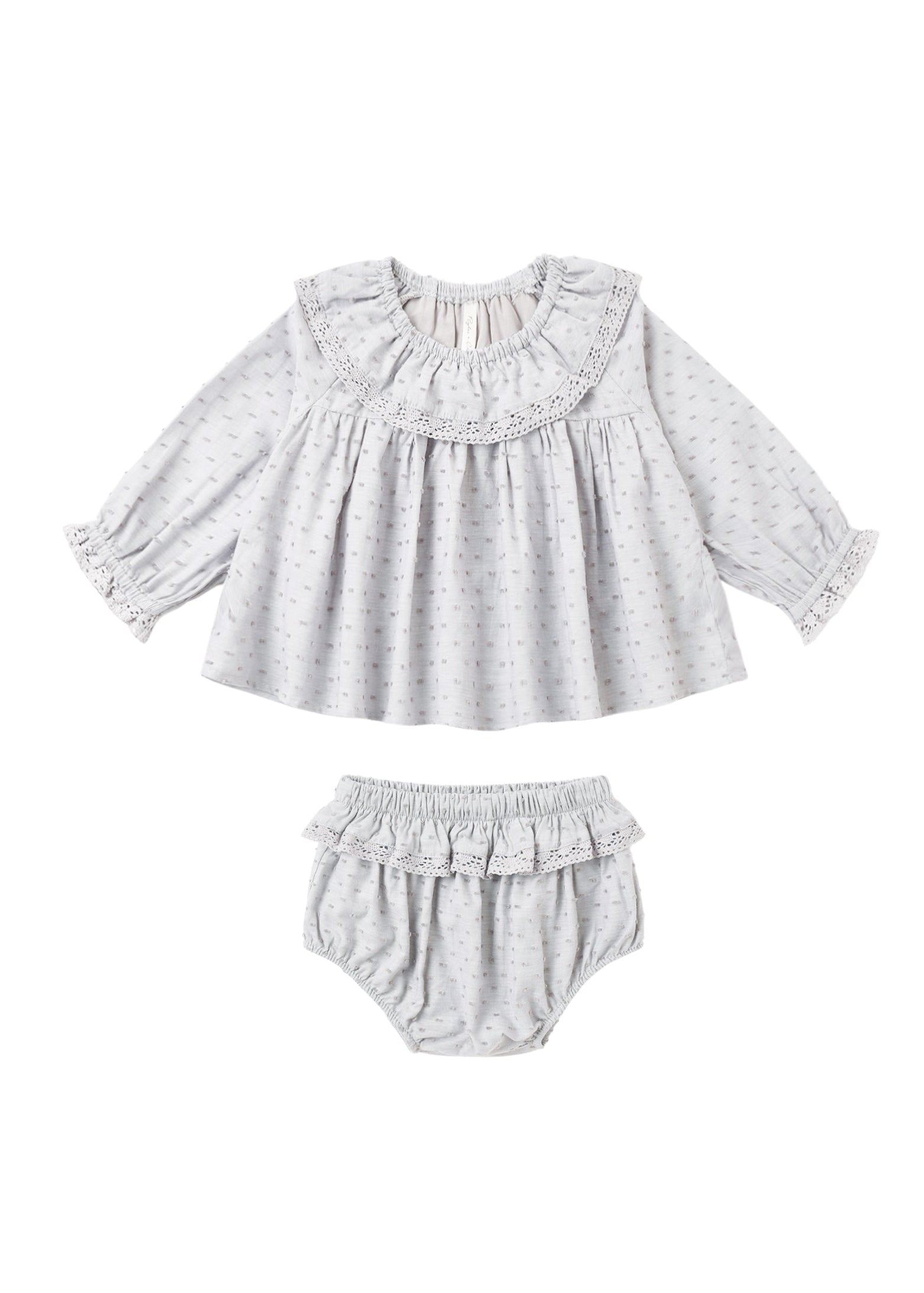 A baby girl's two-piece outfit set featuring a long-sleeve blouse and matching bloomers. The set is made of a light gray and white micro-patterned fabric with ruffle details on the collar, cuffs, and leg bands.