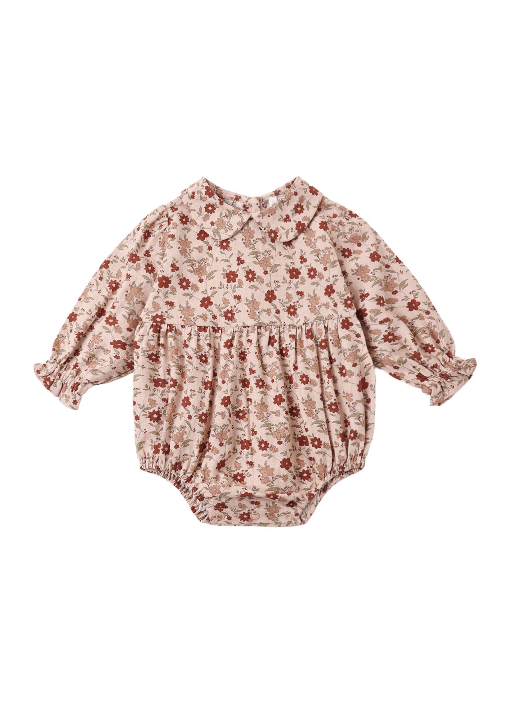 A baby long-sleeve romper in a beige and brown floral print with red accents, featuring a Peter Pan collar, smocked chest, and elastic leg cuffs, shown flat on a white background.