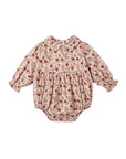 A baby long-sleeve romper in a beige and brown floral print with red accents, featuring a Peter Pan collar, smocked chest, and elastic leg cuffs, shown flat on a white background.