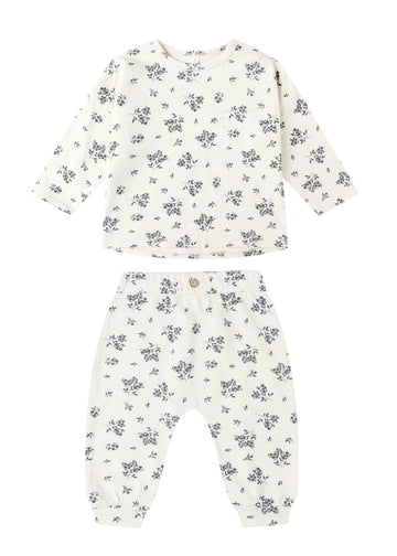 Floral-patterned baby outfit on a white background