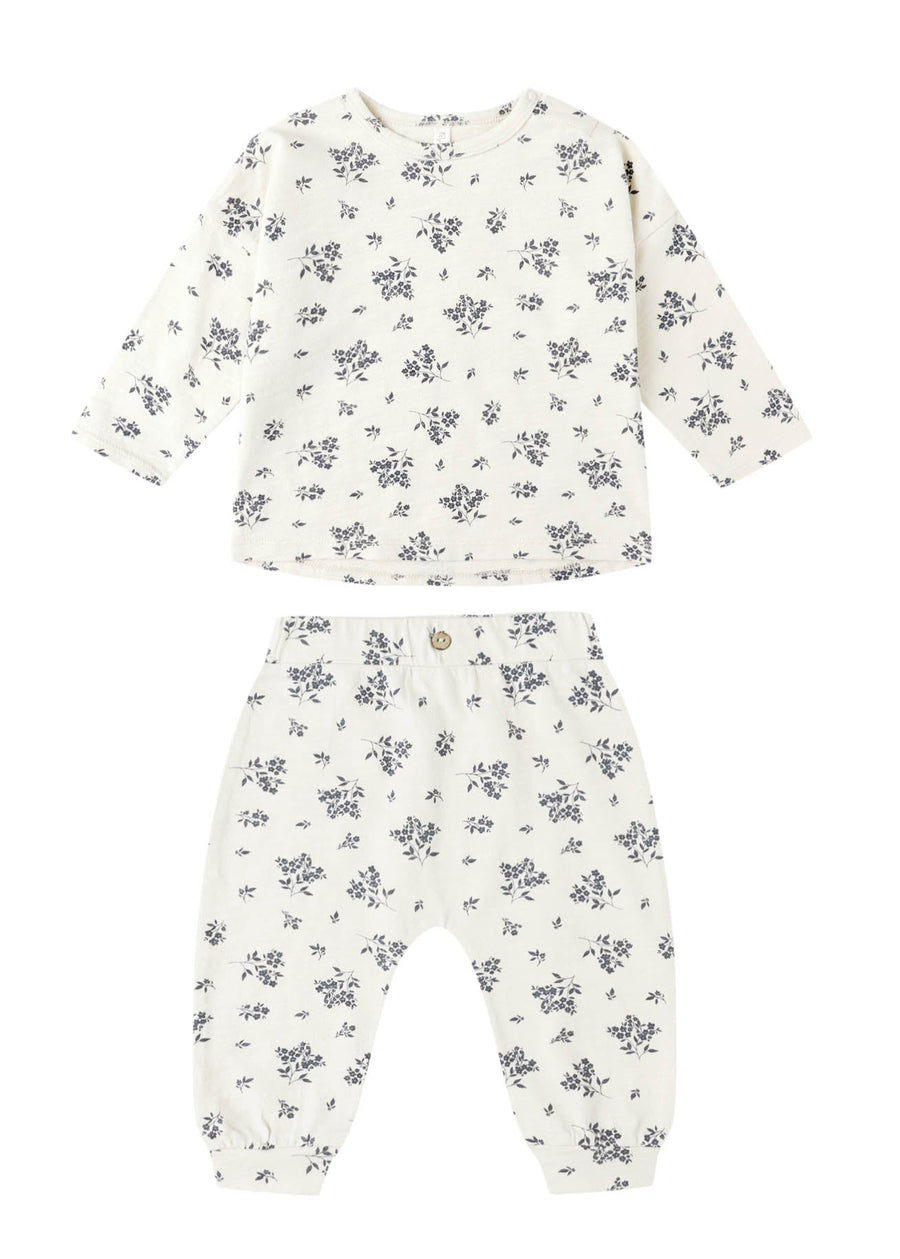 Floral-patterned baby outfit on a white background