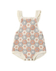 Baby romper with floral pattern on a white background