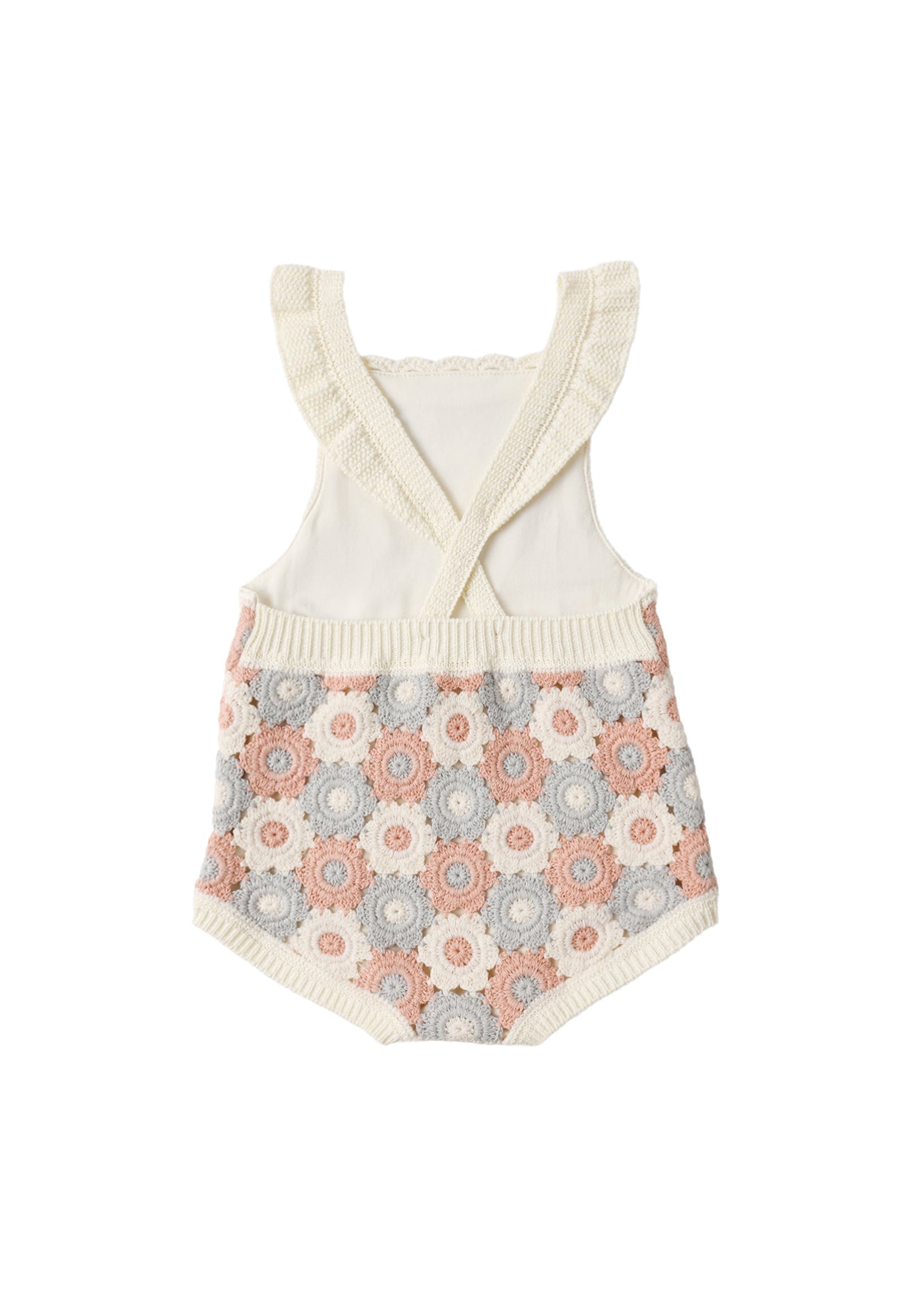 Baby romper with floral pattern and ruffled top on a white background