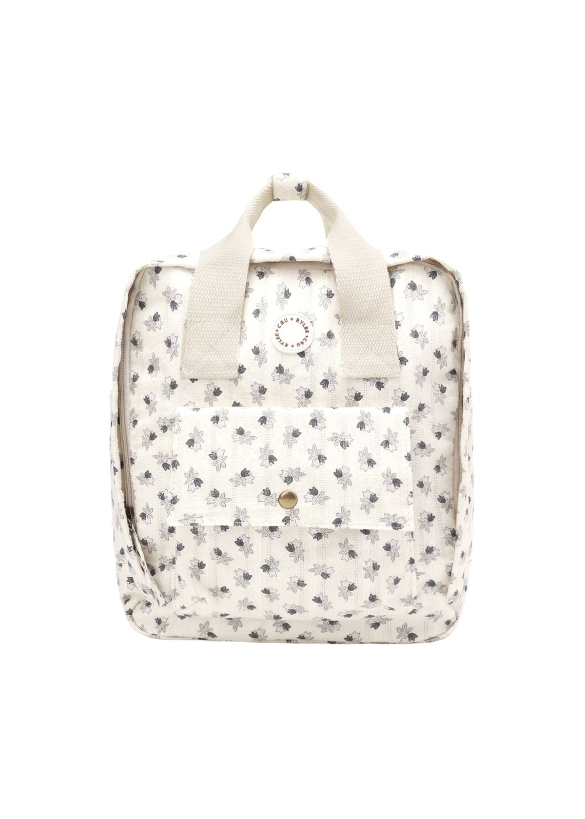 A small cream-colored backpack with a delicate black floral print, featuring top handles and a front pocket, shown against a plain white background.