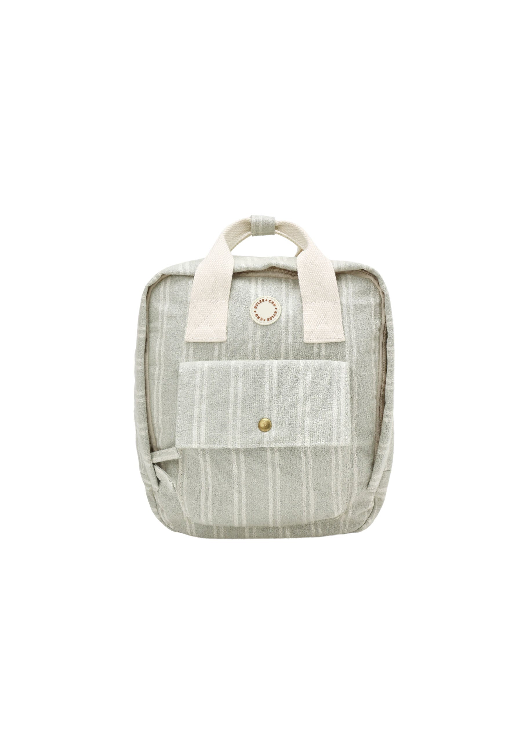 A small striped canvas backpack in a muted sage green and cream color, featuring cream-colored top handles and a front pocket with a gold snap button.