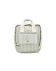 A small striped canvas backpack in a muted sage green and cream color, featuring cream-colored top handles and a front pocket with a gold snap button.