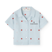 Light blue shirt with red polka dots on a white background