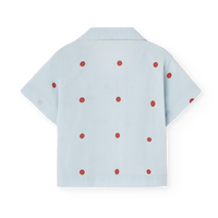 Light blue shirt with red polka dots on a white background