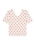 White blouse with red star pattern on a white background