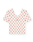 White blouse with red star pattern on a white background