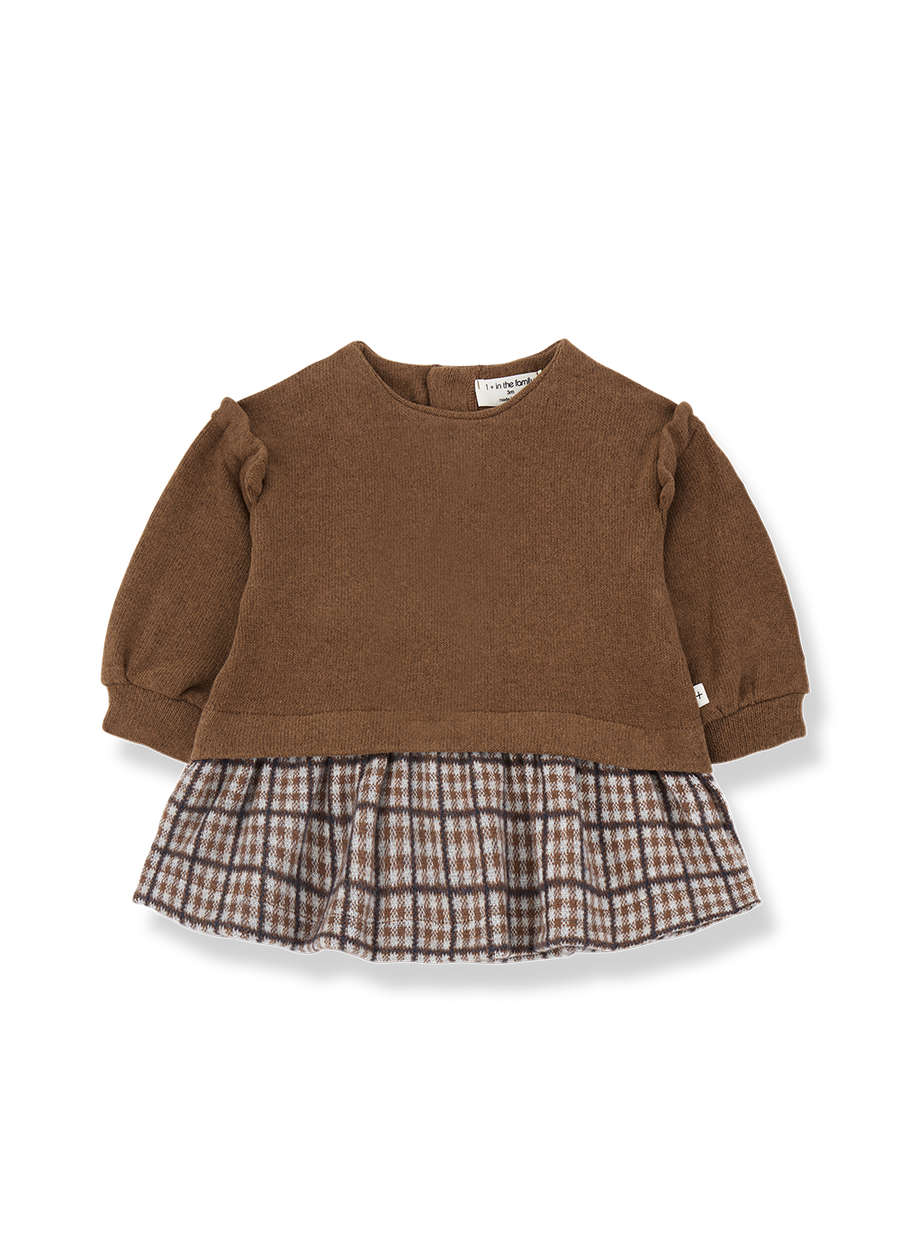 Brown sweater with plaid skirt on a white background