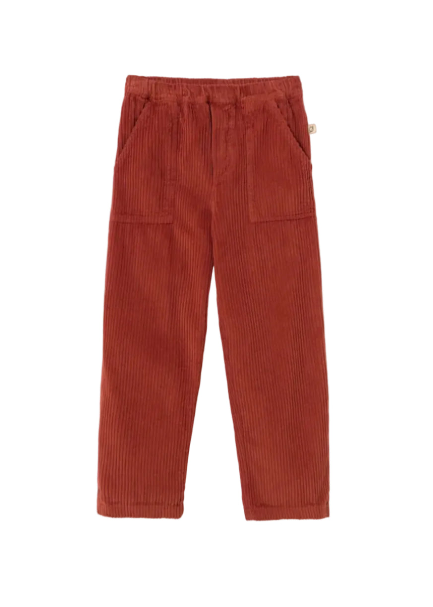 A pair of rust-colored corduroy pants with a drawstring waist and side pockets, displayed flat against a light gray background.