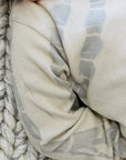 Close-up of a textured fabric with a pattern on a woven surface