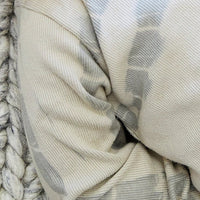 Close-up of a textured fabric with a pattern on a woven surface