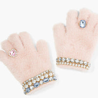 Pair of light pink gloves with decorative gemstones on a white background