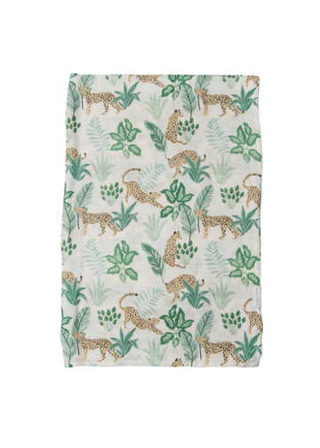 Fabric with a pattern of leopards and tropical leaves on a white background