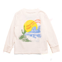 Ecru long sleeve shirt with a graphic design on the back featuring a desert scene and text.